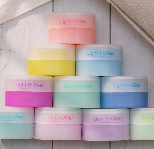 Diax Light Shower head with sleek chrome finish and multiple spray settings mounted on a bathroom wall.