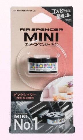 Pink Air Spencer MINI No. 1 Series vent air freshener attached to car vent, compact and stylish design with fresh scent.