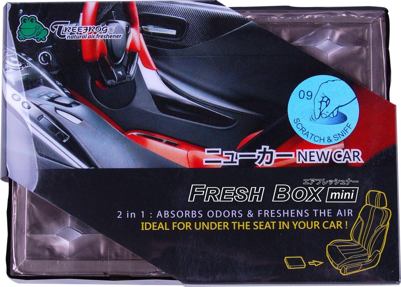 Treefrog Freshbox Mini in a new car interior, compact portable air purifier with modern design and air filter visible.